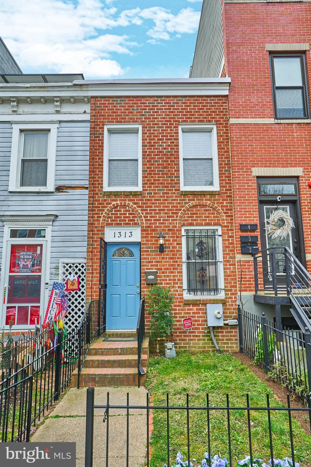 1313 K Street Southeast Washington, DC 20003 - Photo 2 of 48 a front view of a house with outdoor seating
