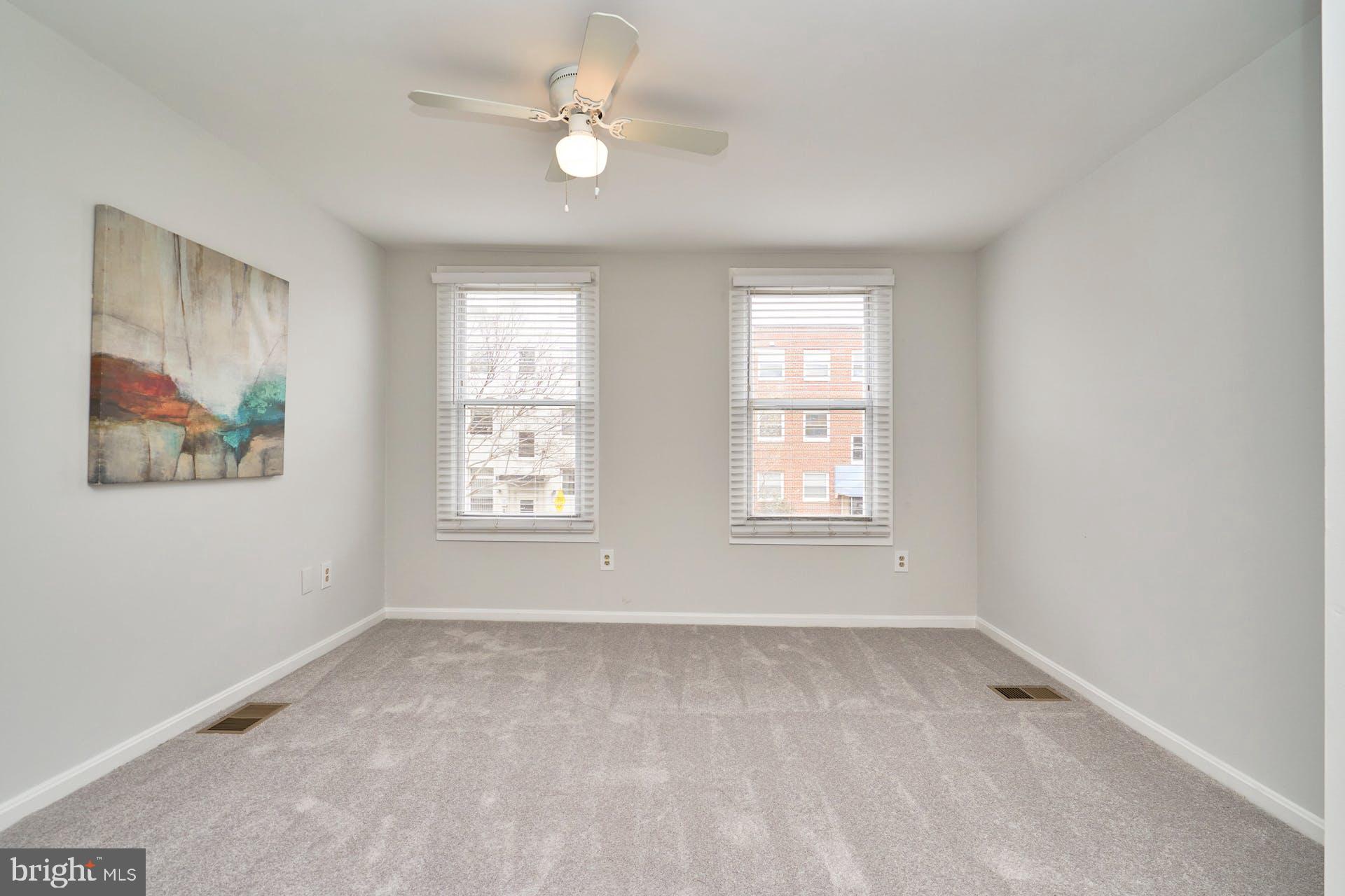 1313 K Street Southeast Washington, DC 20003 - Photo 24 of 48 an empty room with windows and fan