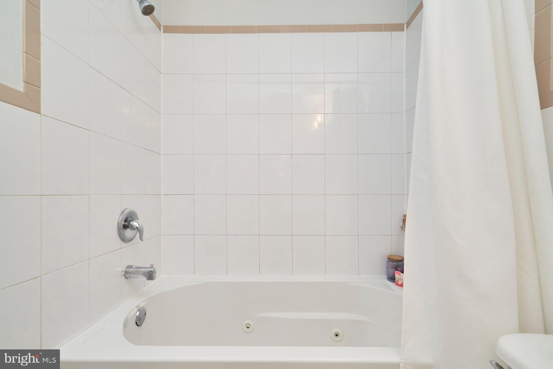 1313 K Street Southeast Washington, DC 20003 - Photo 28 of 48 a close up of a bathtub curtain