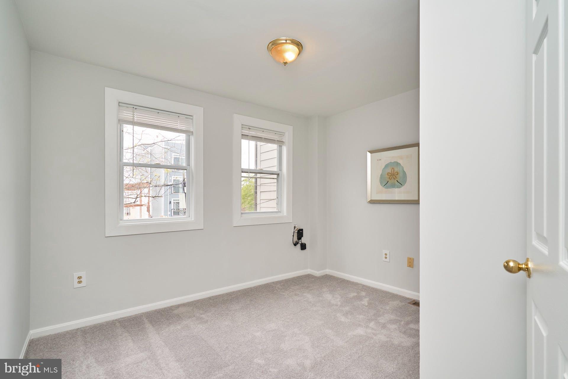 1313 K Street Southeast Washington, DC 20003 - Photo 29 of 48 an empty room with windows