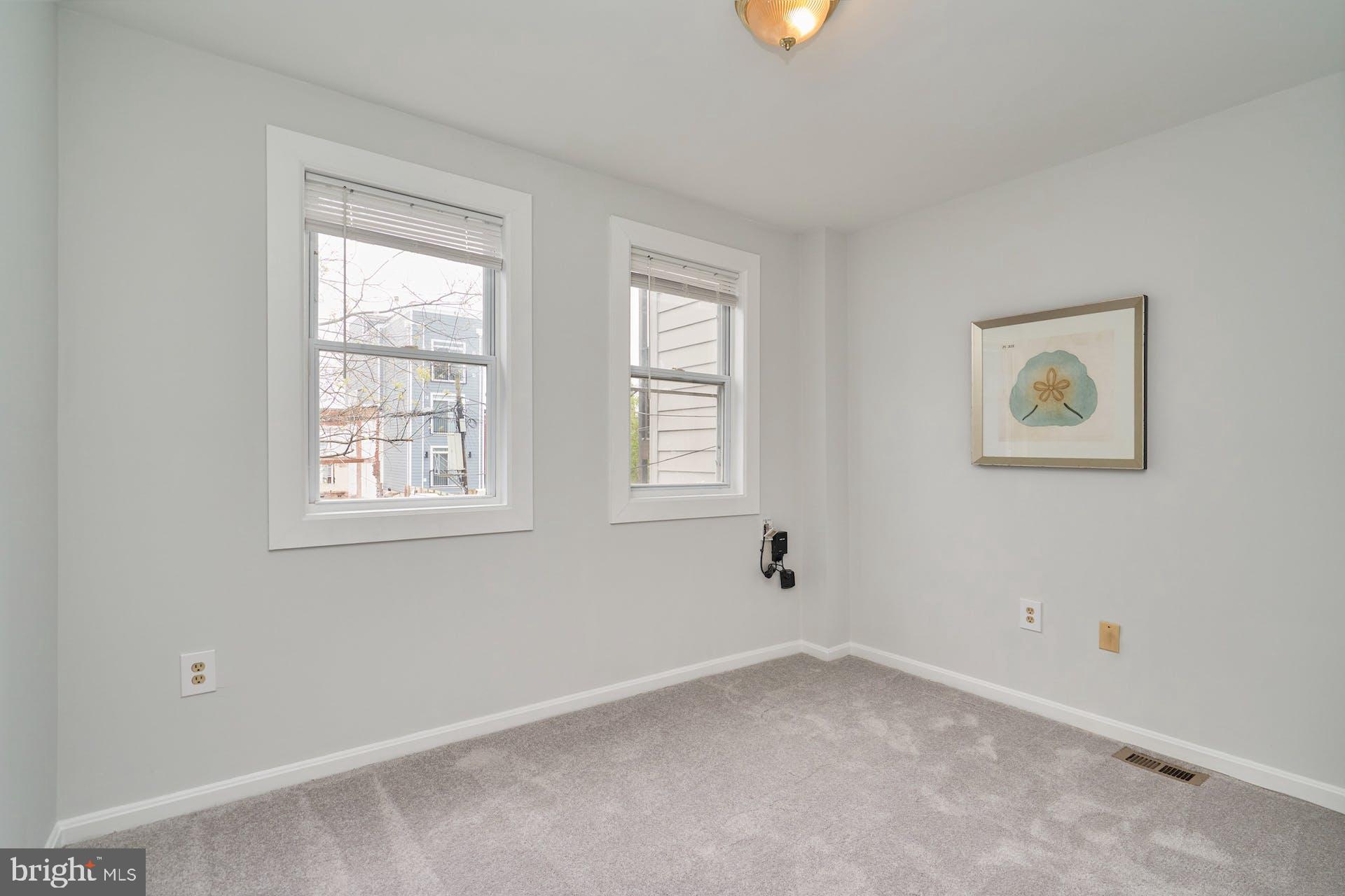 1313 K Street Southeast Washington, DC 20003 - Photo 30 of 48 an empty room with windows
