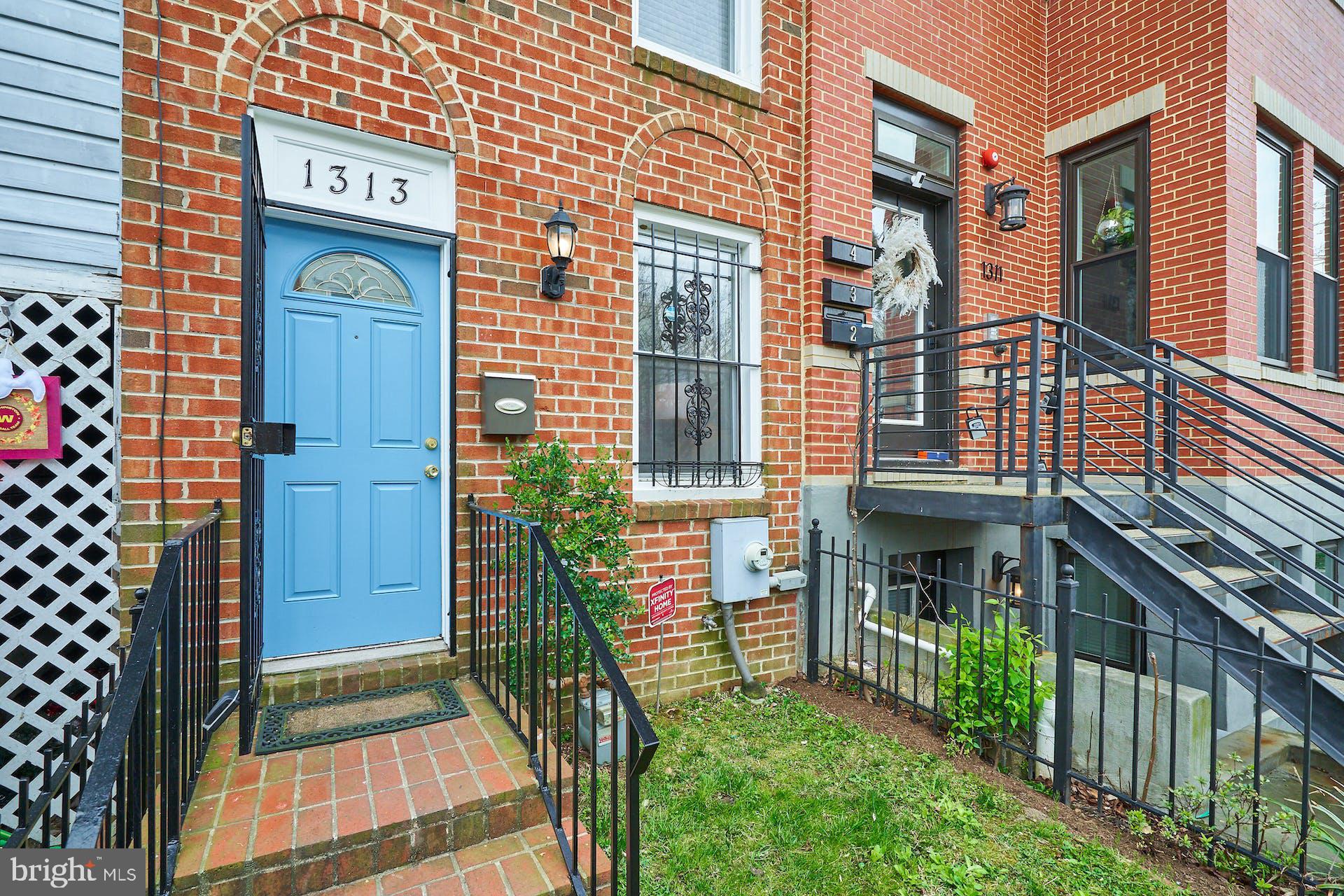 1313 K Street Southeast Washington, DC 20003 - Photo 3 of 48 a front view of a house with a porch