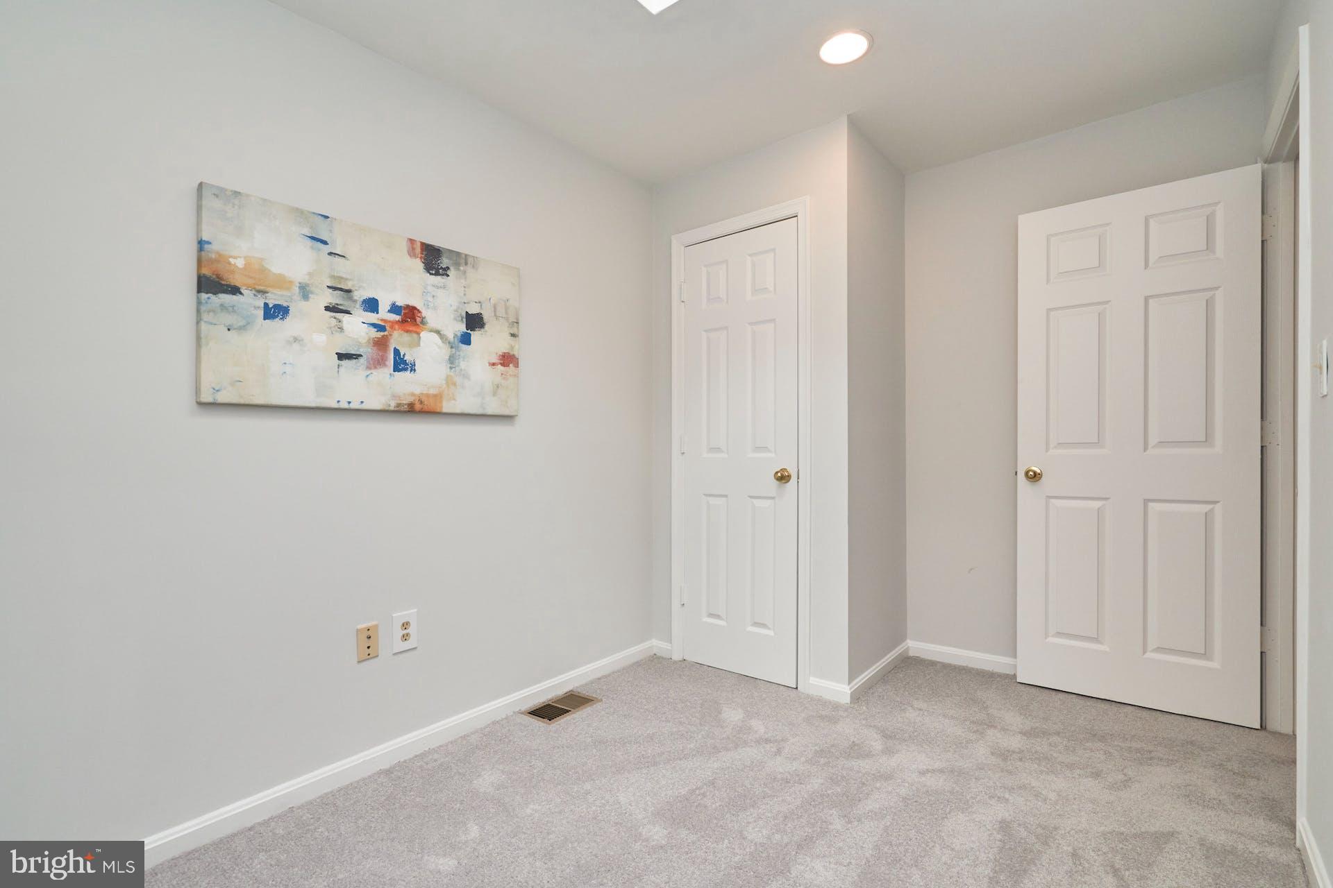 1313 K Street Southeast Washington, DC 20003 - Photo 33 of 48 an empty room with painting on the wall