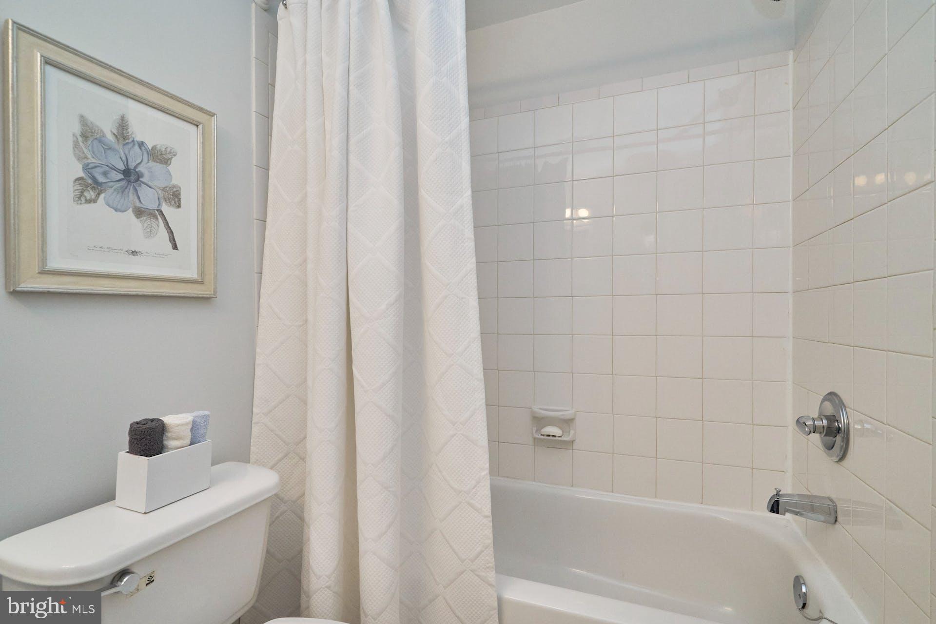 1313 K Street Southeast Washington, DC 20003 - Photo 35 of 48 a bathroom with a toilet and a tub