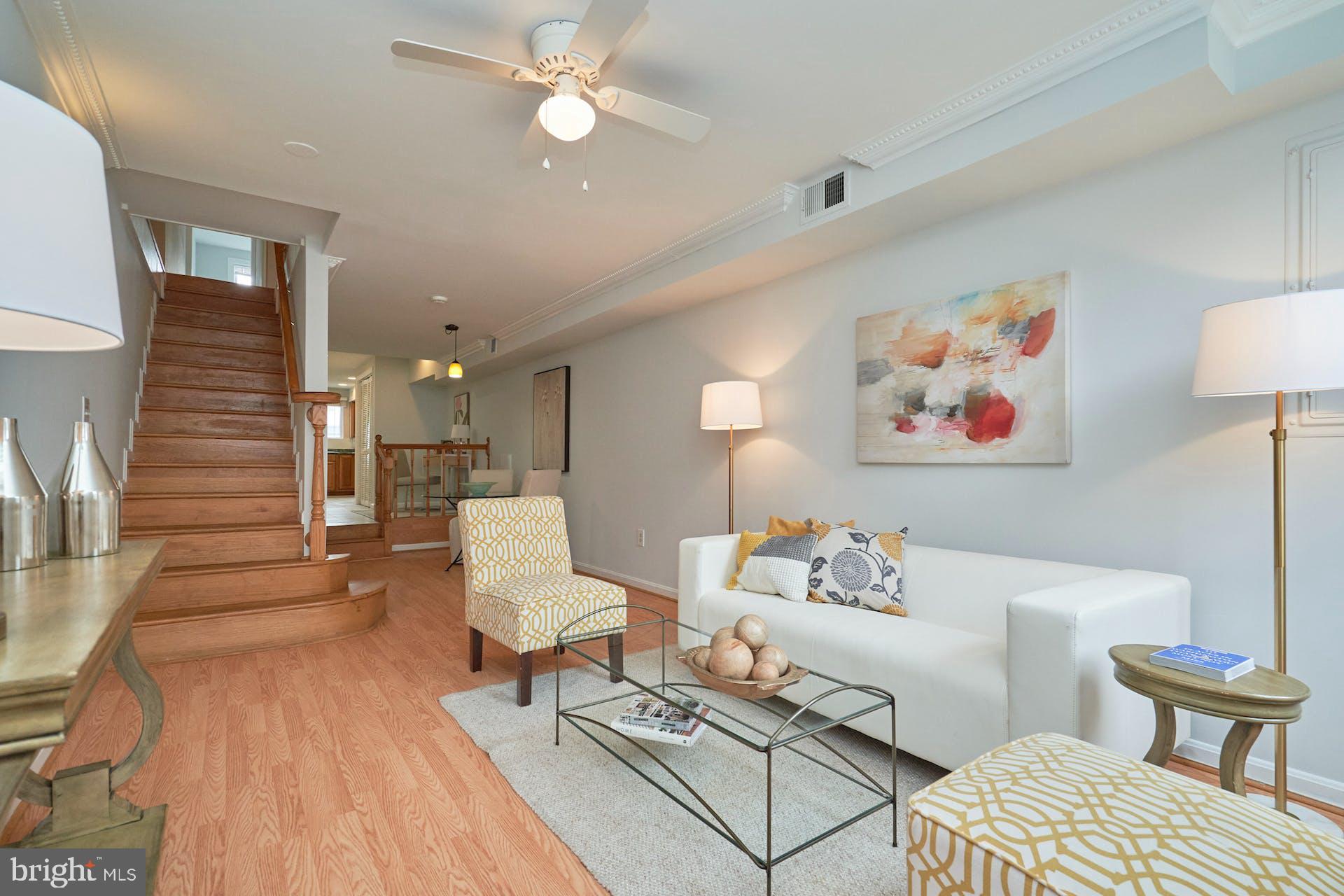1313 K Street Southeast Washington, DC 20003 - Photo 9 of 48 a living room with furniture and a wooden floor