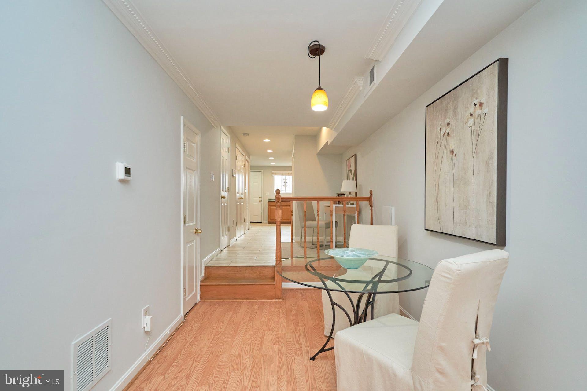 1313 K Street Southeast Washington, DC 20003 - Photo 10 of 48 a dining room with furniture and a chandelier
