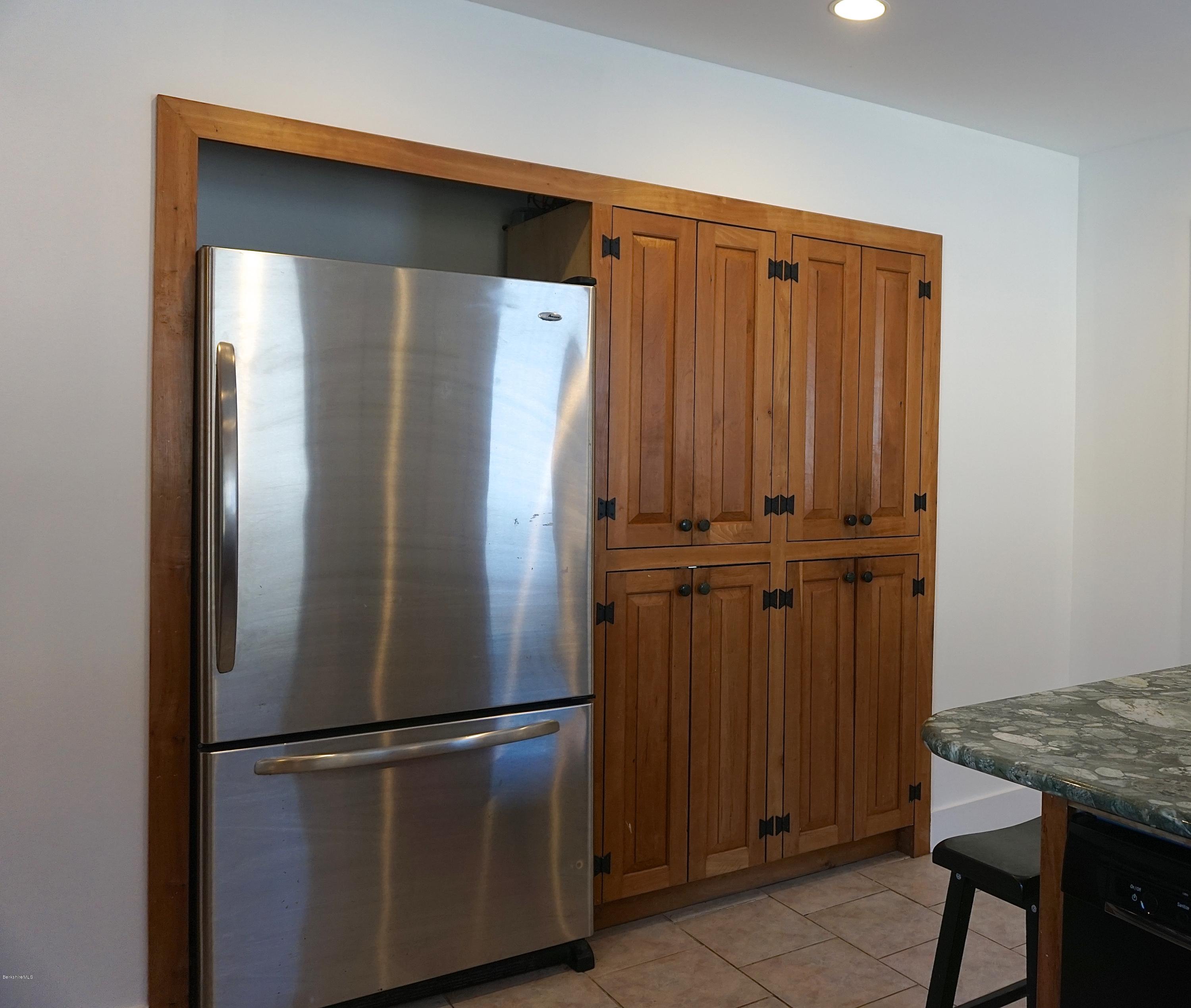 38 Sandisfield Road Monterey, MA 01245 - Photo 12 of 25 a view of a refrigerator in kitchen