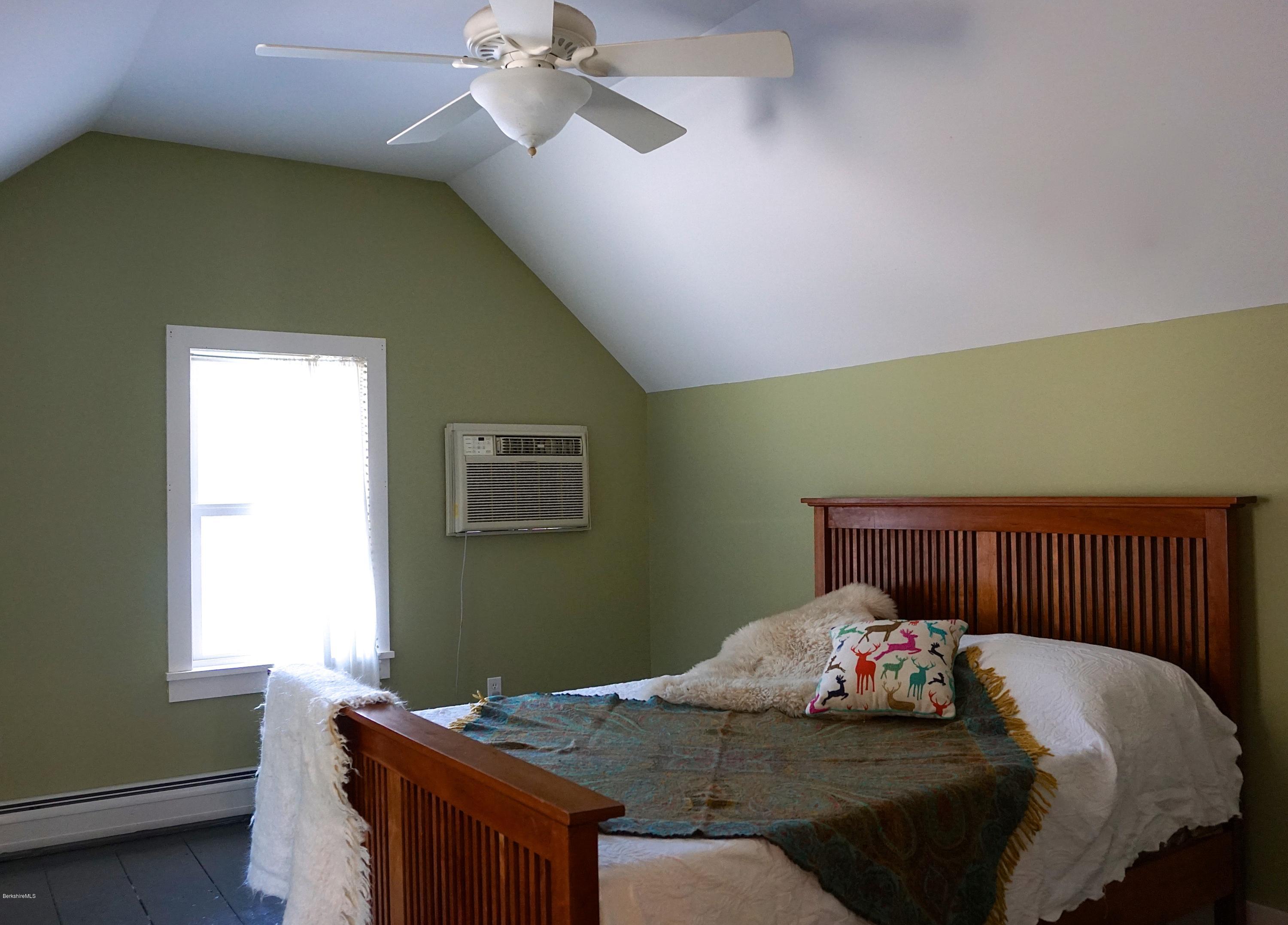 38 Sandisfield Road Monterey, MA 01245 - Photo 14 of 25 a bedroom with a bed and a window