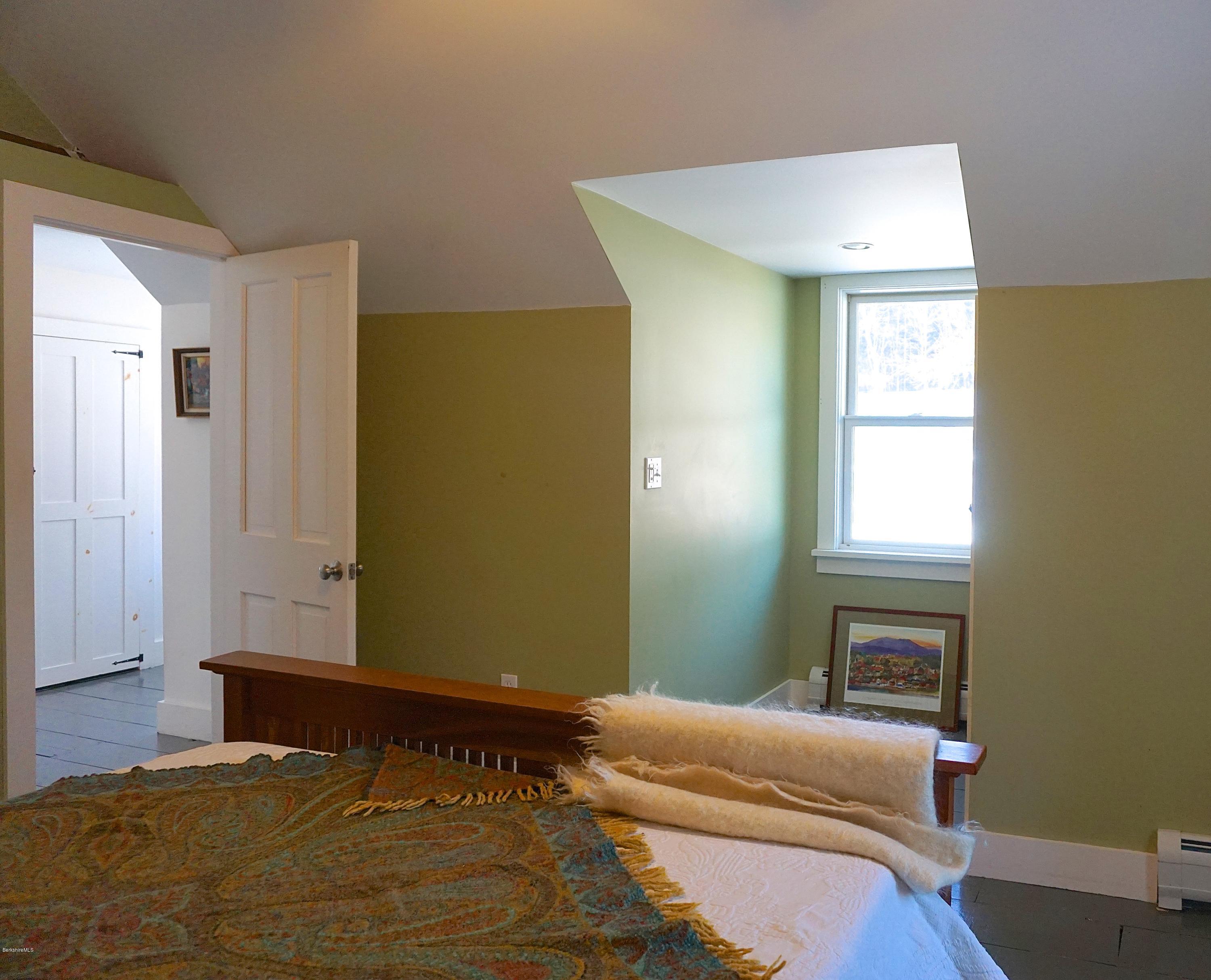 38 Sandisfield Road Monterey, MA 01245 - Photo 15 of 25 a bedroom with a bed and a window