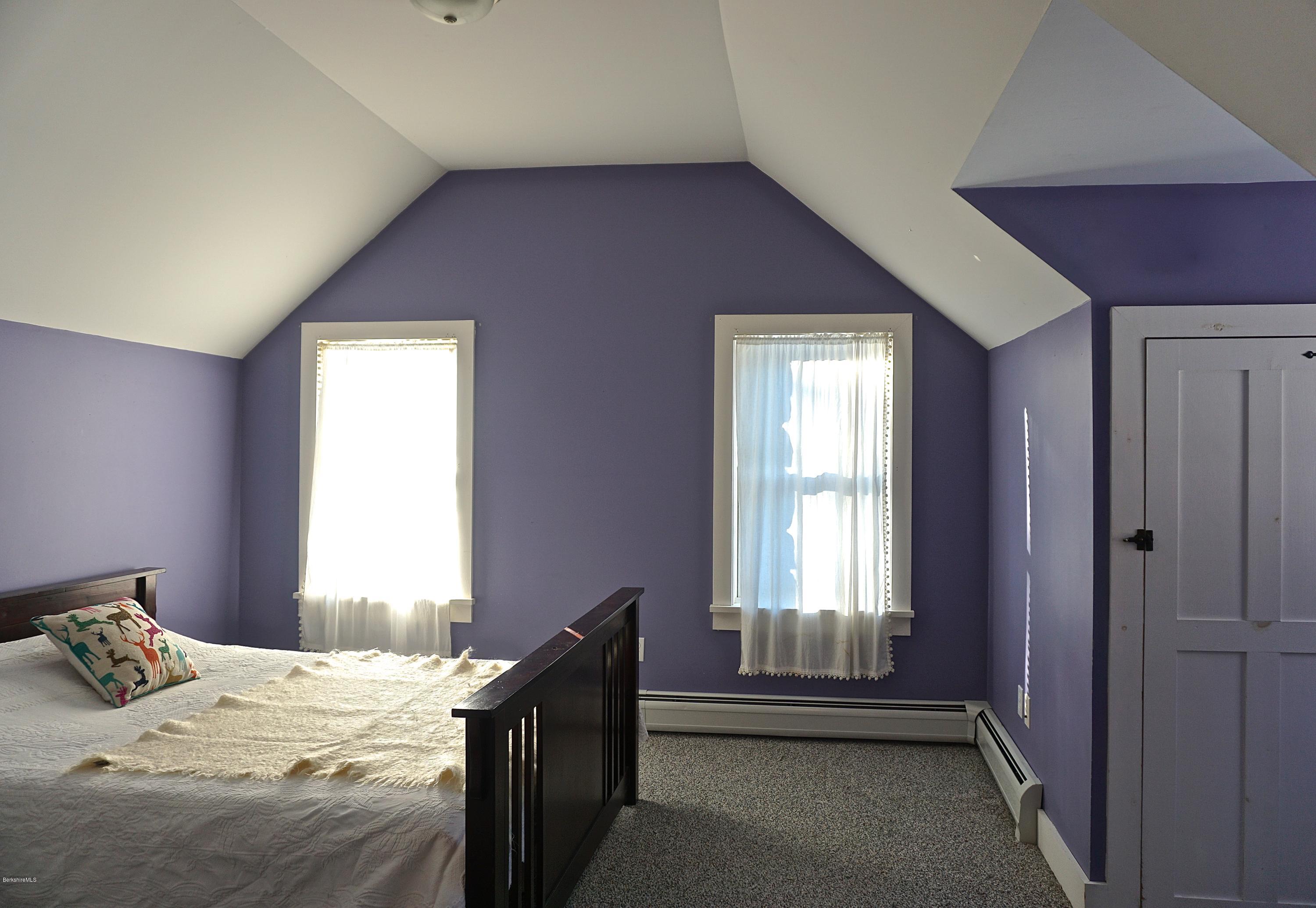 38 Sandisfield Road Monterey, MA 01245 - Photo 18 of 25 a bedroom with a bed and a window