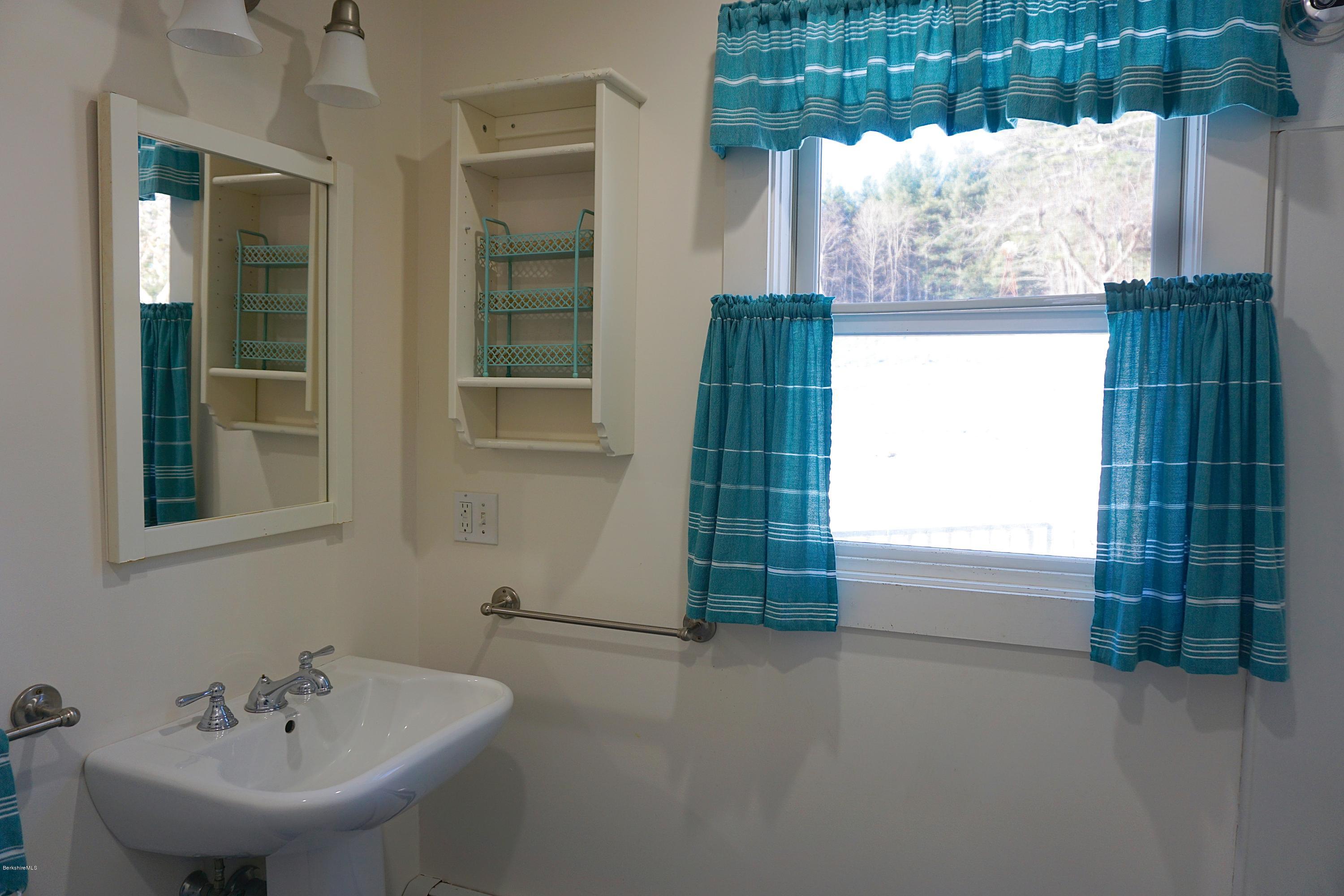 38 Sandisfield Road Monterey, MA 01245 - Photo 20 of 25 a bathroom with a sink and a bathtub