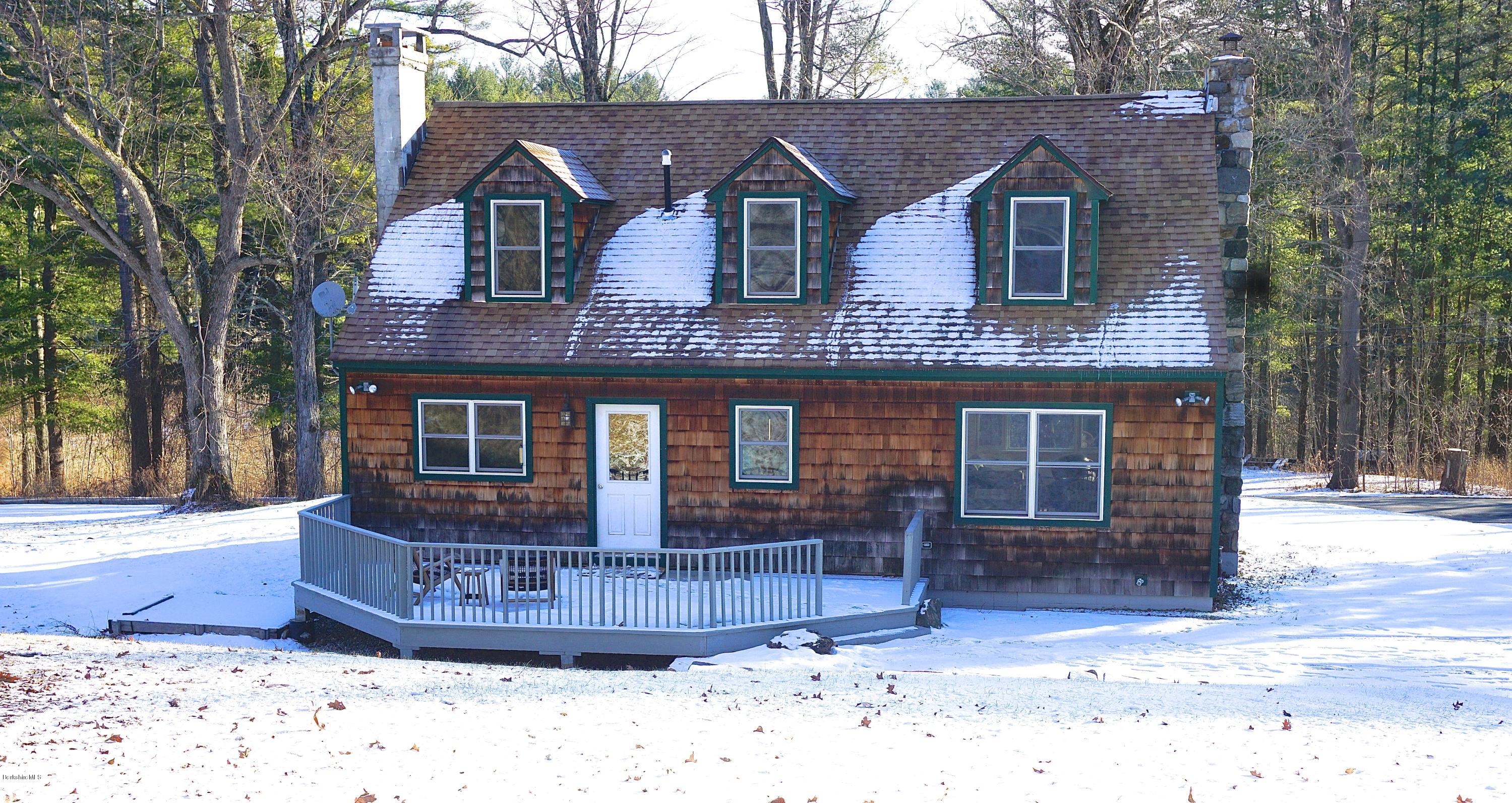 38 Sandisfield Road Monterey, MA 01245 - Photo 24 of 25 a front view of a house with a yard