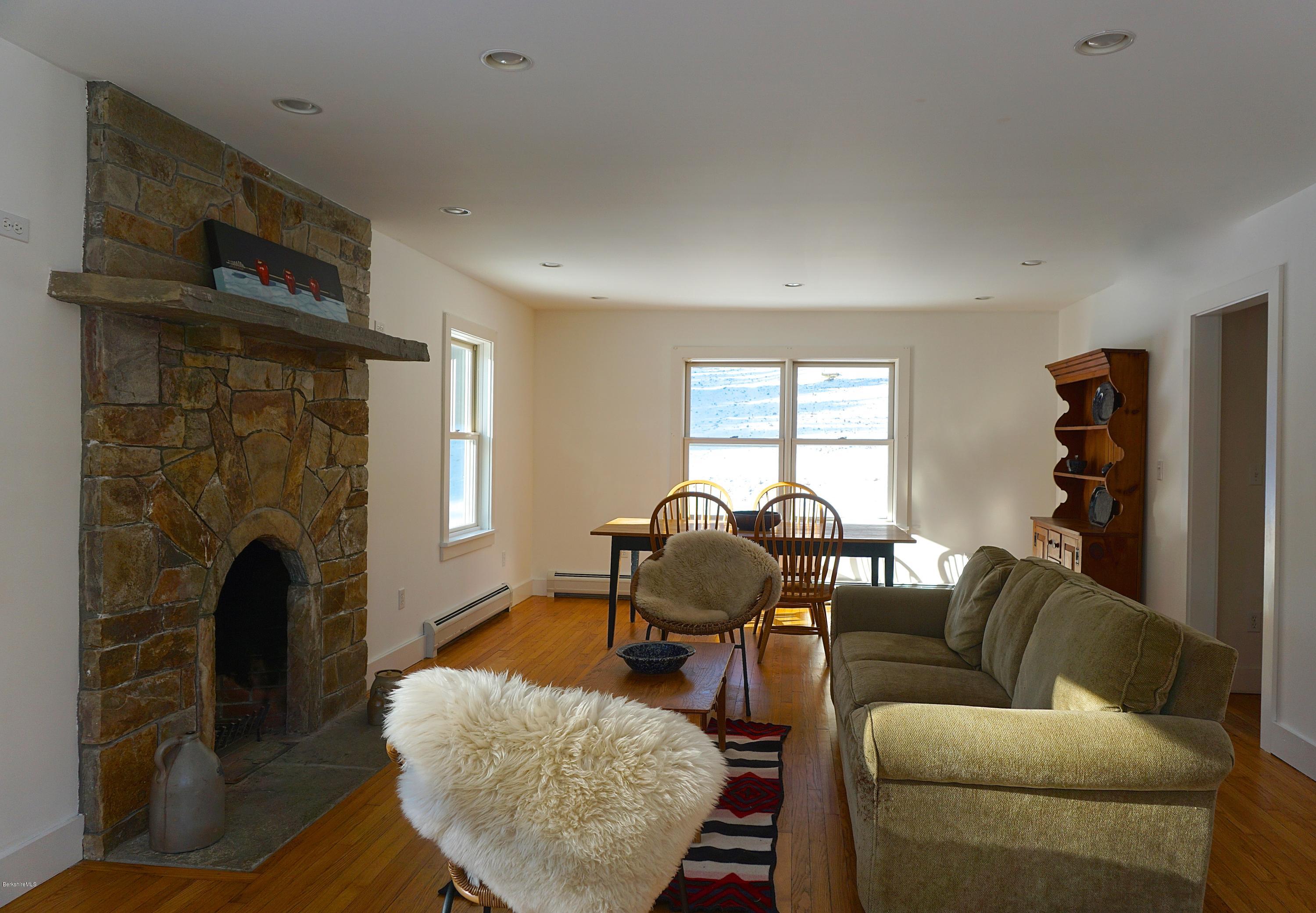 38 Sandisfield Road Monterey, MA 01245 - Photo 5 of 25 a living room with furniture and a fireplace