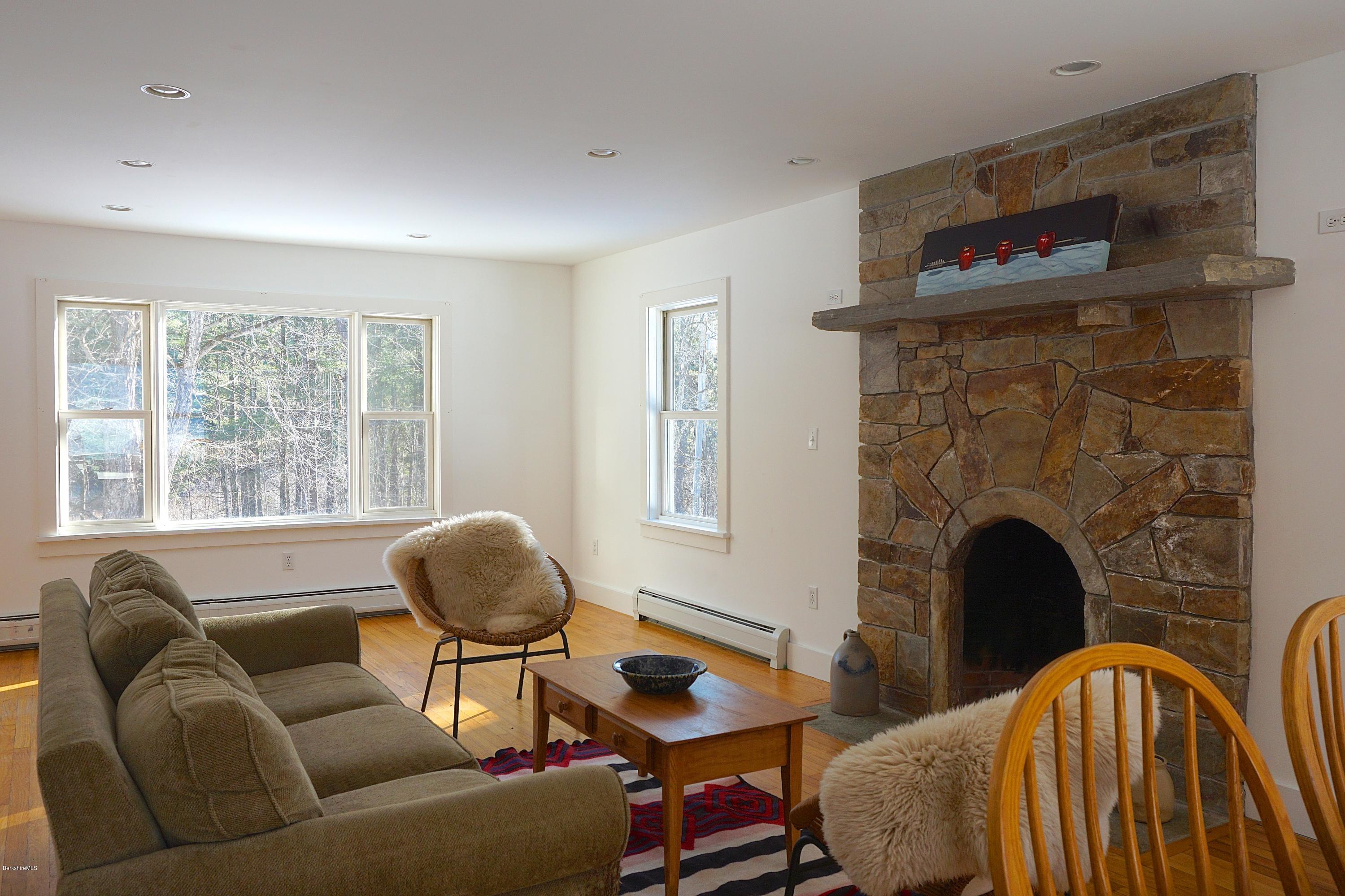 38 Sandisfield Road Monterey, MA 01245 - Photo 6 of 25 a living room with furniture and a fireplace
