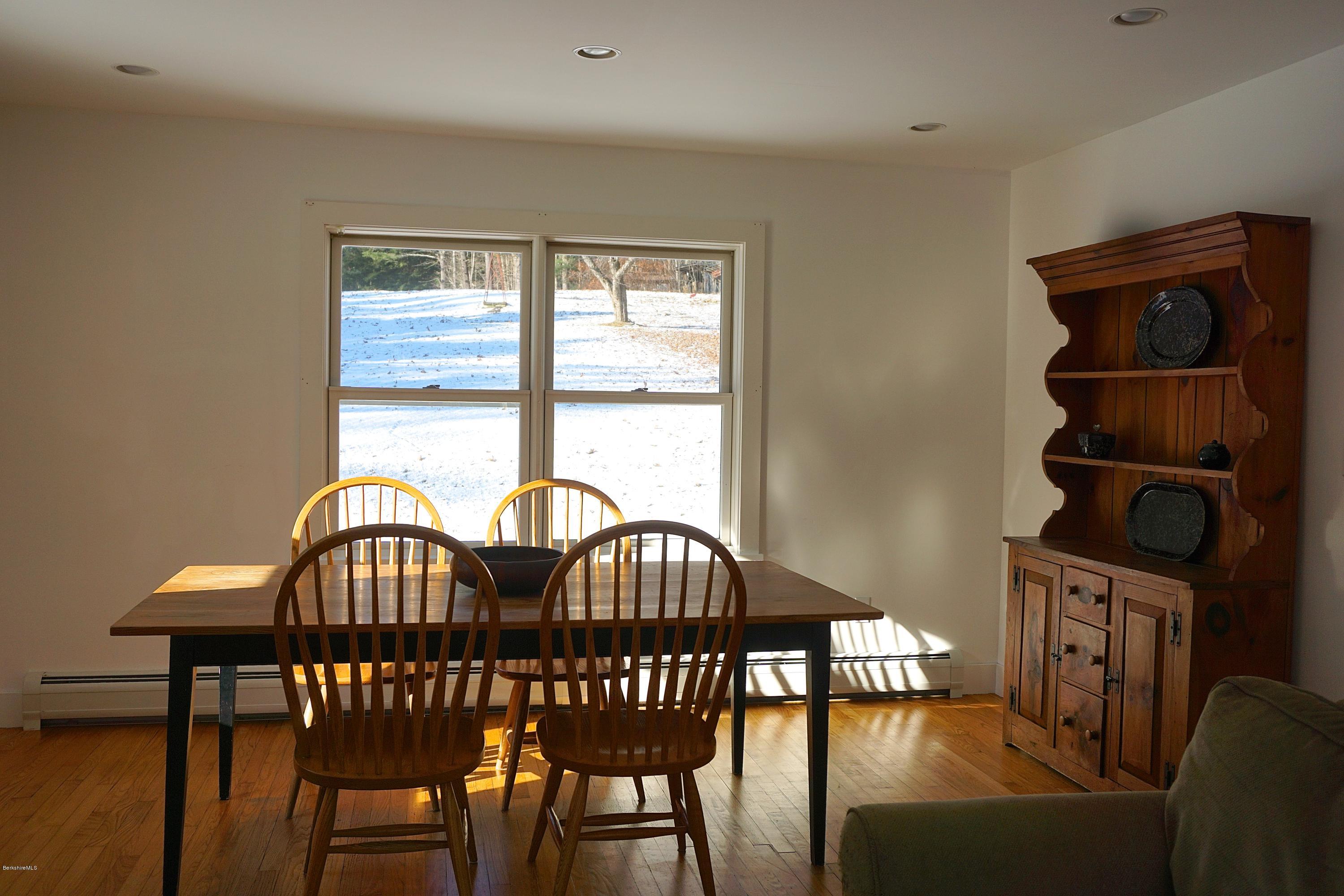 38 Sandisfield Road Monterey, MA 01245 - Photo 7 of 25 a view of a dining room with furniture and window