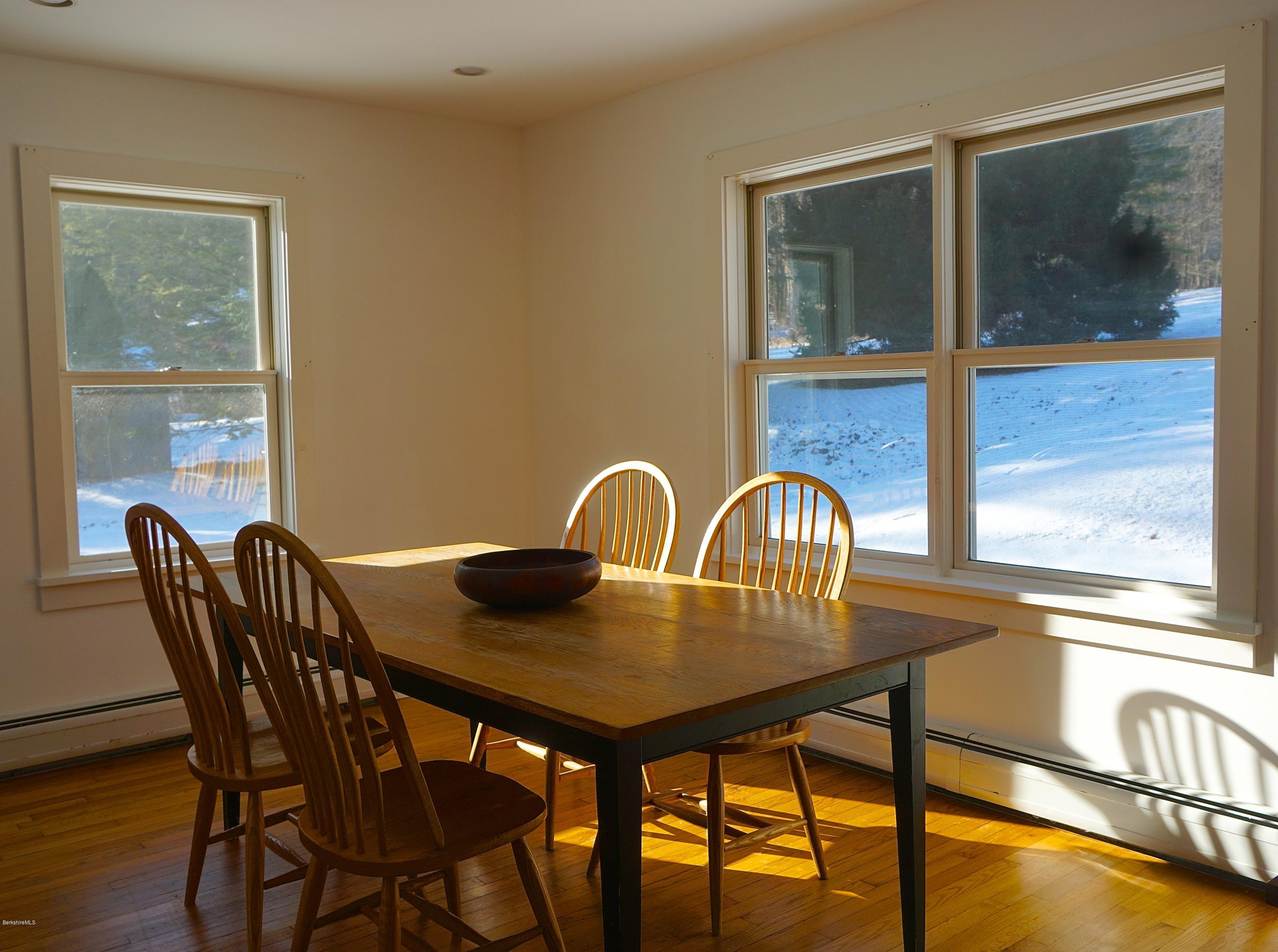 38 Sandisfield Road Monterey, MA 01245 - Photo 8 of 25 a view of a dining room with furniture and window
