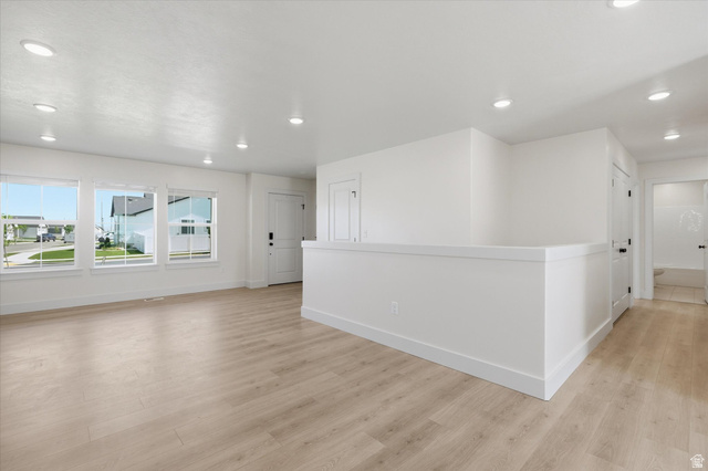 730 West 500 North Smithfield, UT 84335 - Photo 8 of 46 Open concept living area featuring light wood-finish flooring, recessed lighting, and a neutral white color palette