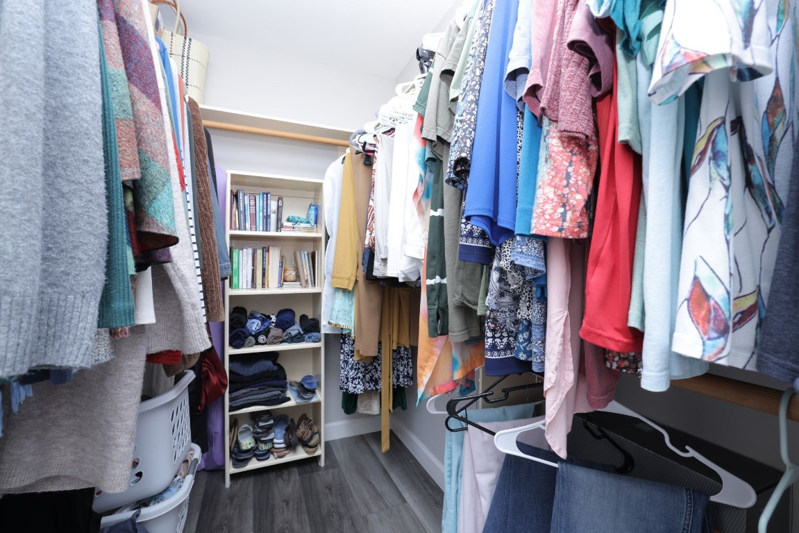 8827 Stoney Bend Drive Spring, TX 77379 - Photo 27 of 39 a view of walk in closet with clothes and shoes