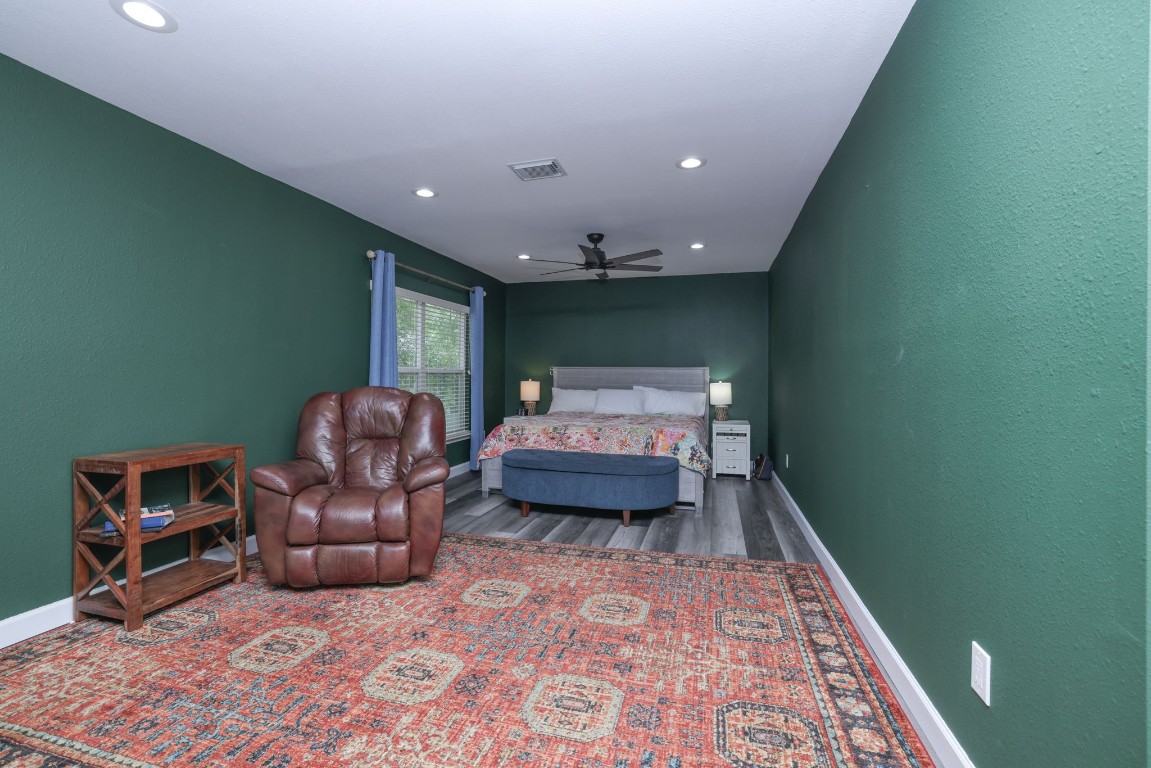 8827 Stoney Bend Drive Spring, TX 77379 - Photo 30 of 39 a bedroom with furniture and a rug