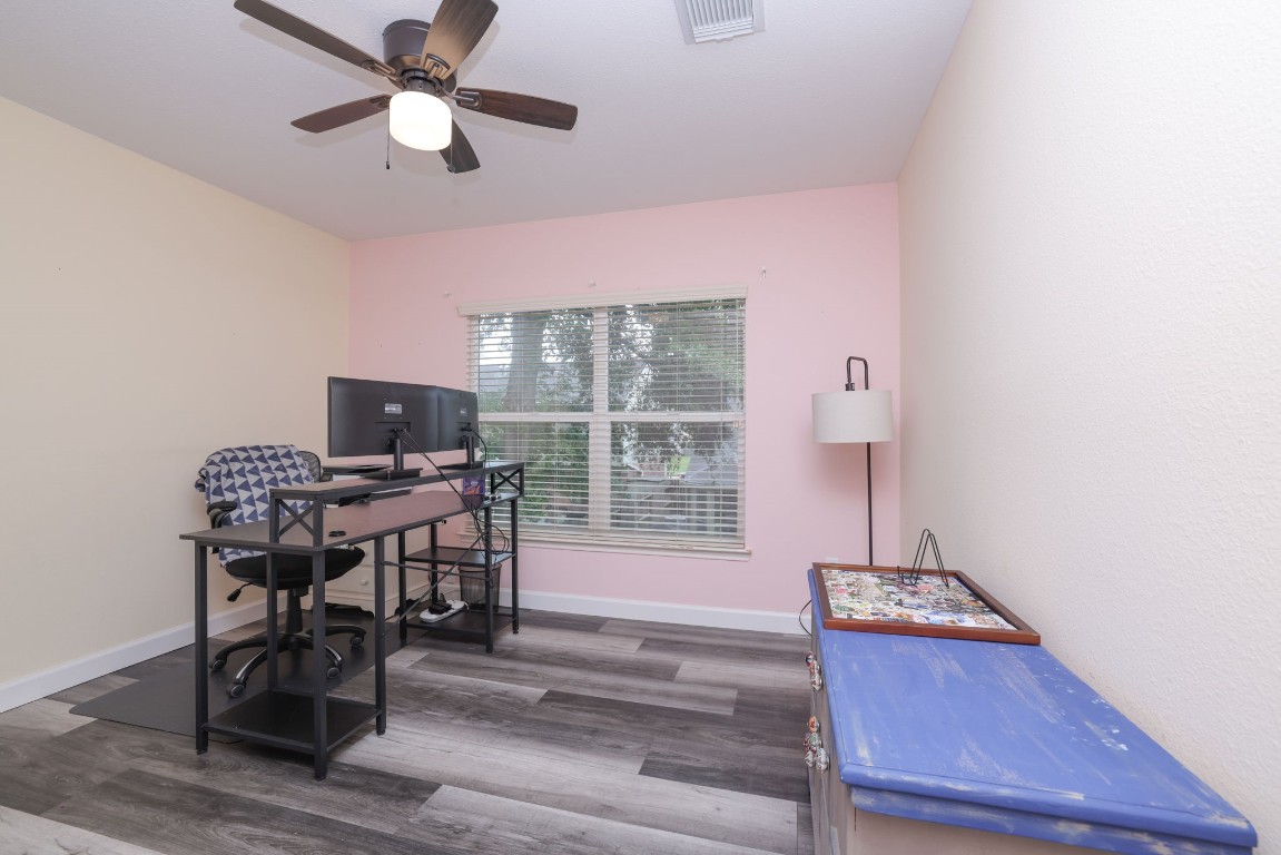 8827 Stoney Bend Drive Spring, TX 77379 - Photo 36 of 39 a view of a workspace with furniture and a window