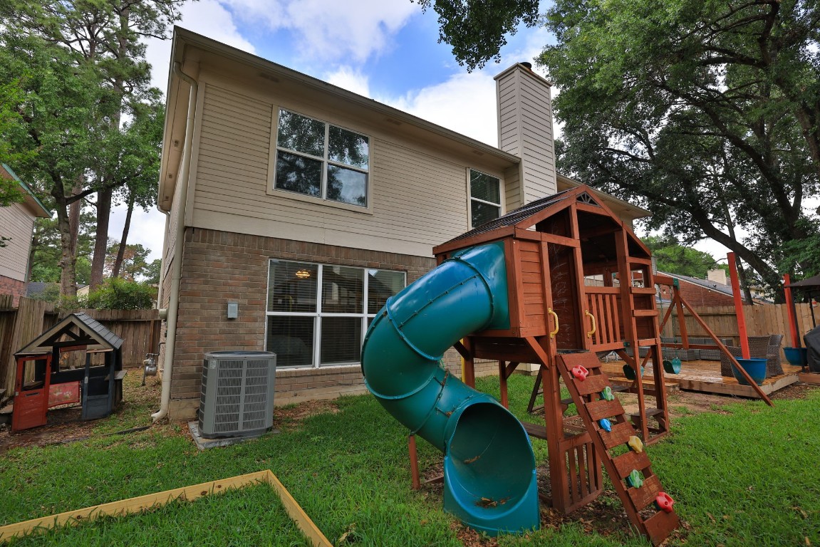 8827 Stoney Bend Drive Spring, TX 77379 - Photo 38 of 39 a view of a house with backyard