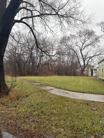 a view of outdoor space with deck and yard