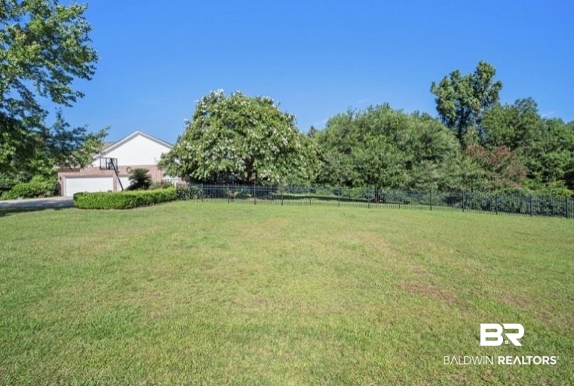 141 Blue Ridge Drive Monroeville, AL 36460 - Photo 32 of 40 View of yard featuring a garage