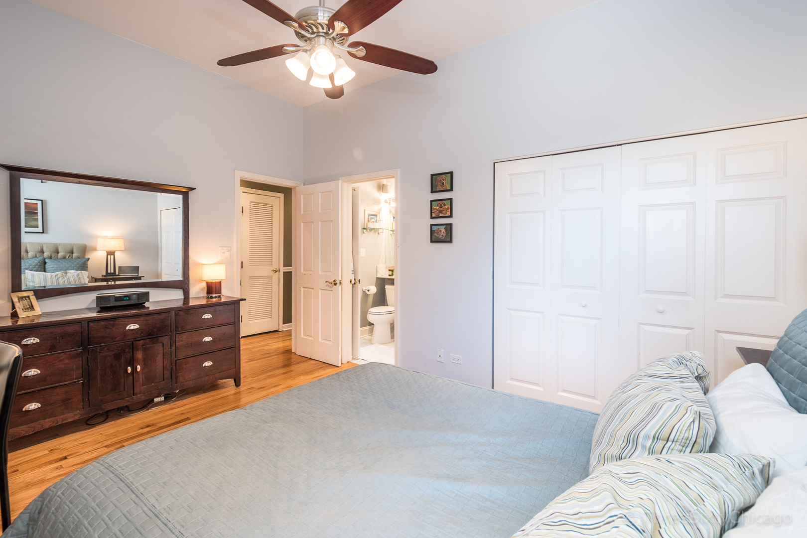 4028 North Sheridan Road, Unit 3 Chicago, IL 60613 - Photo 16 of 25 a bed room with a bed and a dresser