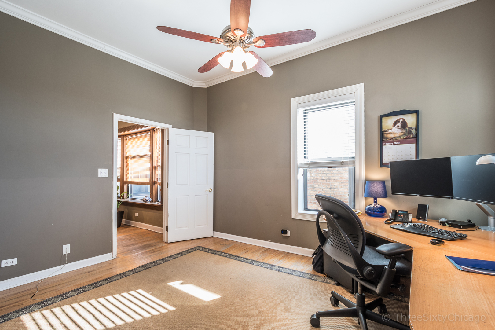 4028 North Sheridan Road, Unit 3 Chicago, IL 60613 - Photo 17 of 25 a view of a workspace with furniture and a window