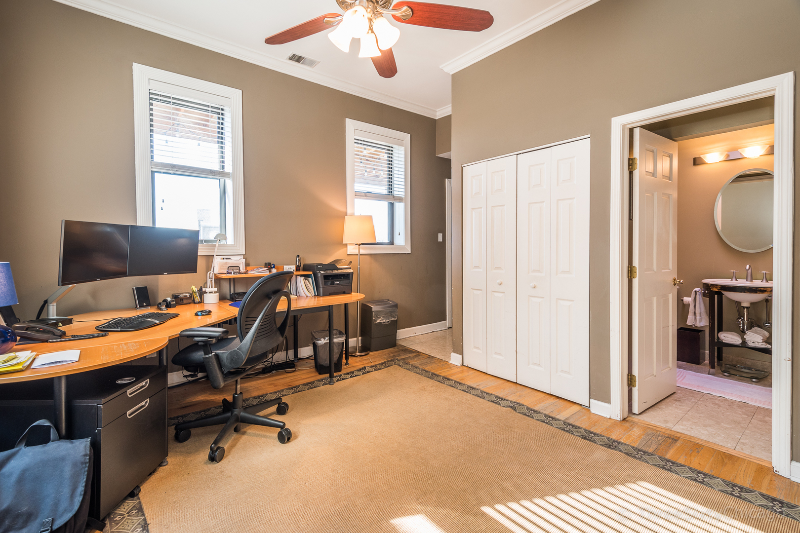4028 North Sheridan Road, Unit 3 Chicago, IL 60613 - Photo 19 of 25 a view of a workspace with furniture and a window