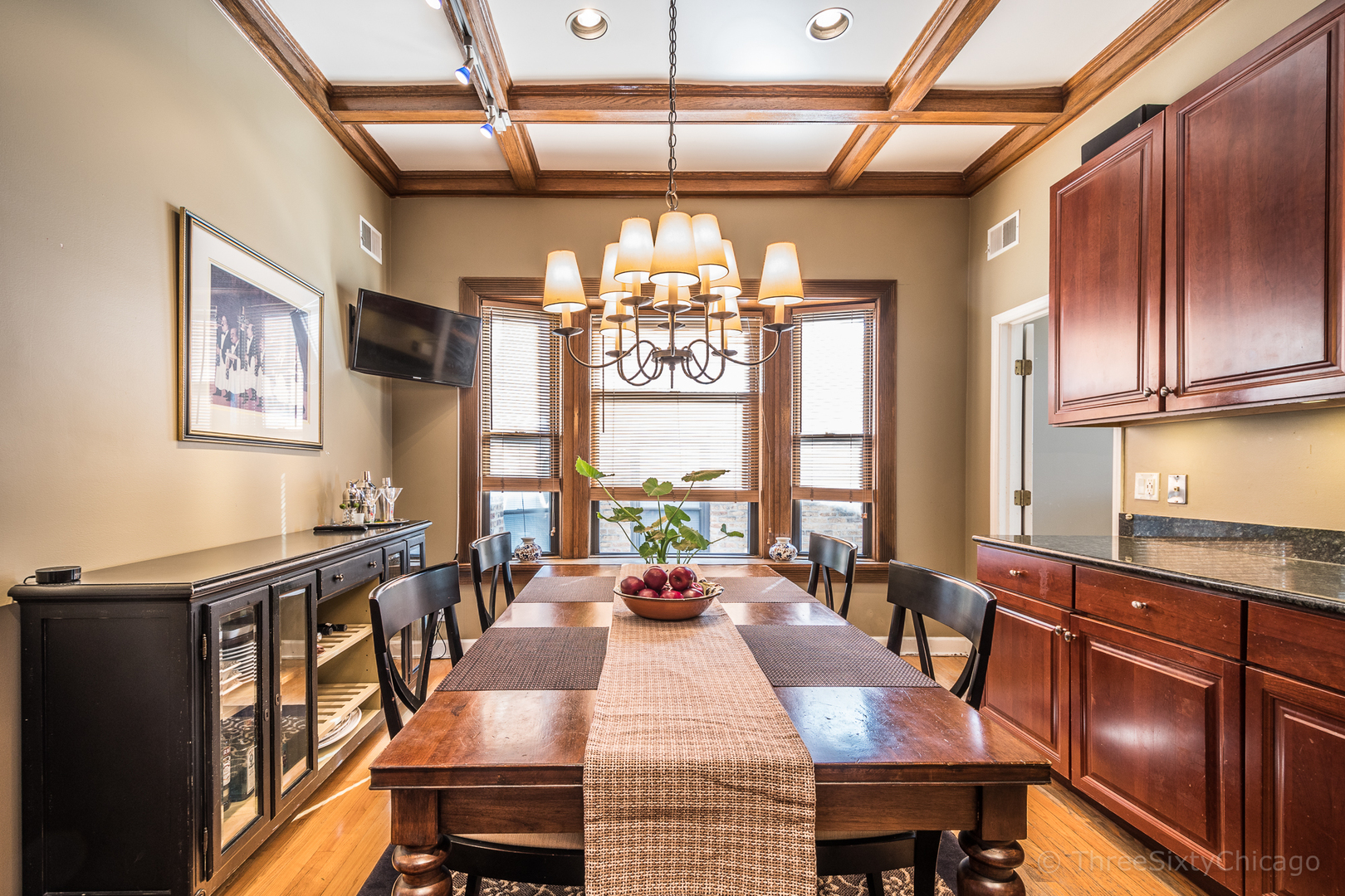 4028 North Sheridan Road, Unit 3 Chicago, IL 60613 - Photo 8 of 25 a view of a dining room with furniture a chandelier and wooden floor