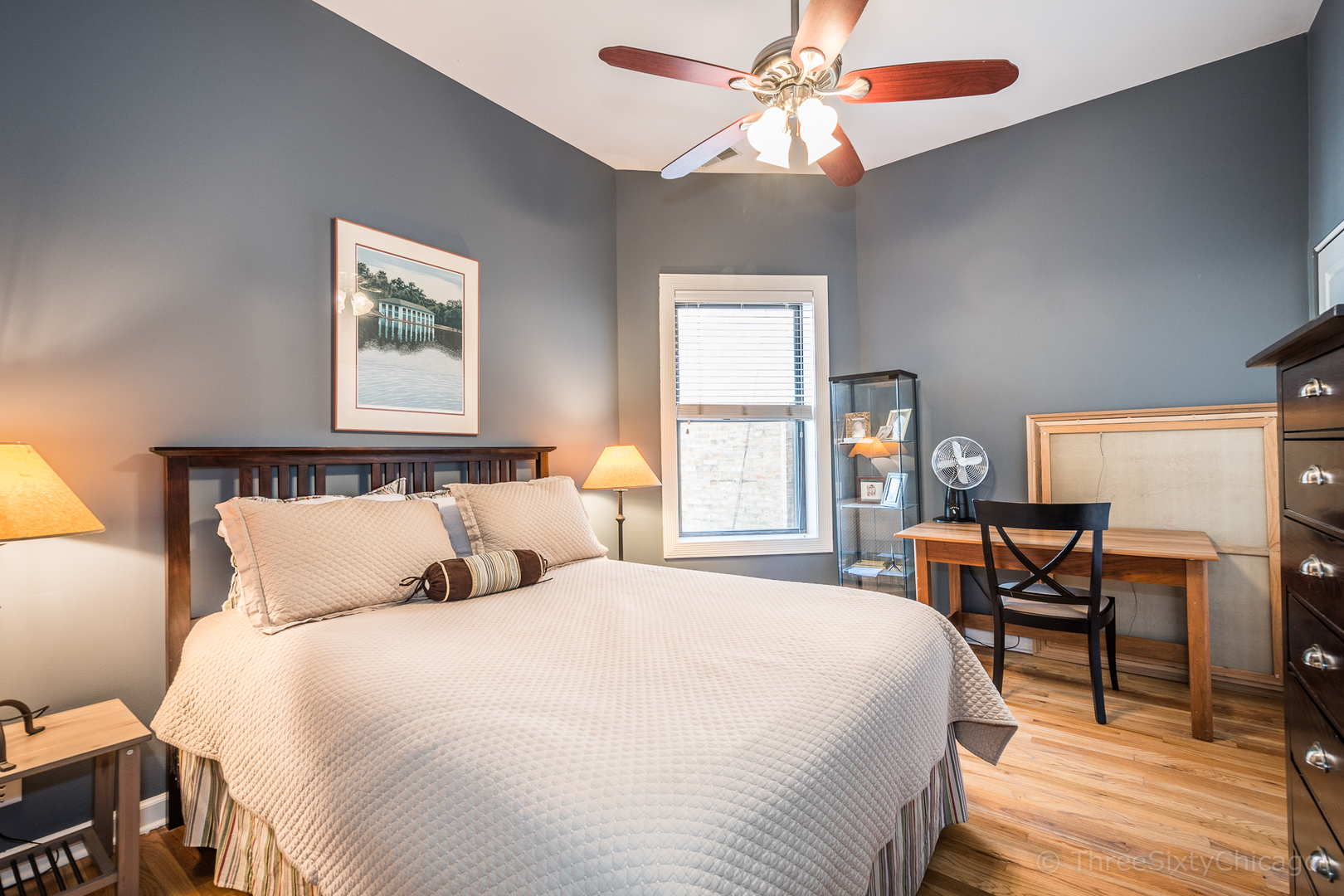 4028 North Sheridan Road, Unit 3 Chicago, IL 60613 - Photo 10 of 25 a bedroom with a bed and a table in it