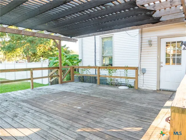 a view of porch with wooden floor