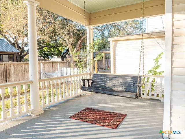 a view of a floor to ceiling window with wooden floor