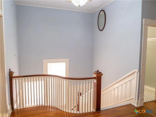 a view of a hallway with windows