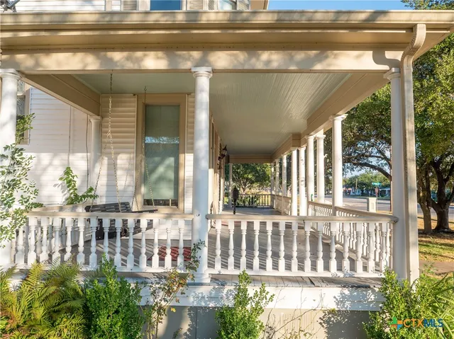 a view of a porch with a door