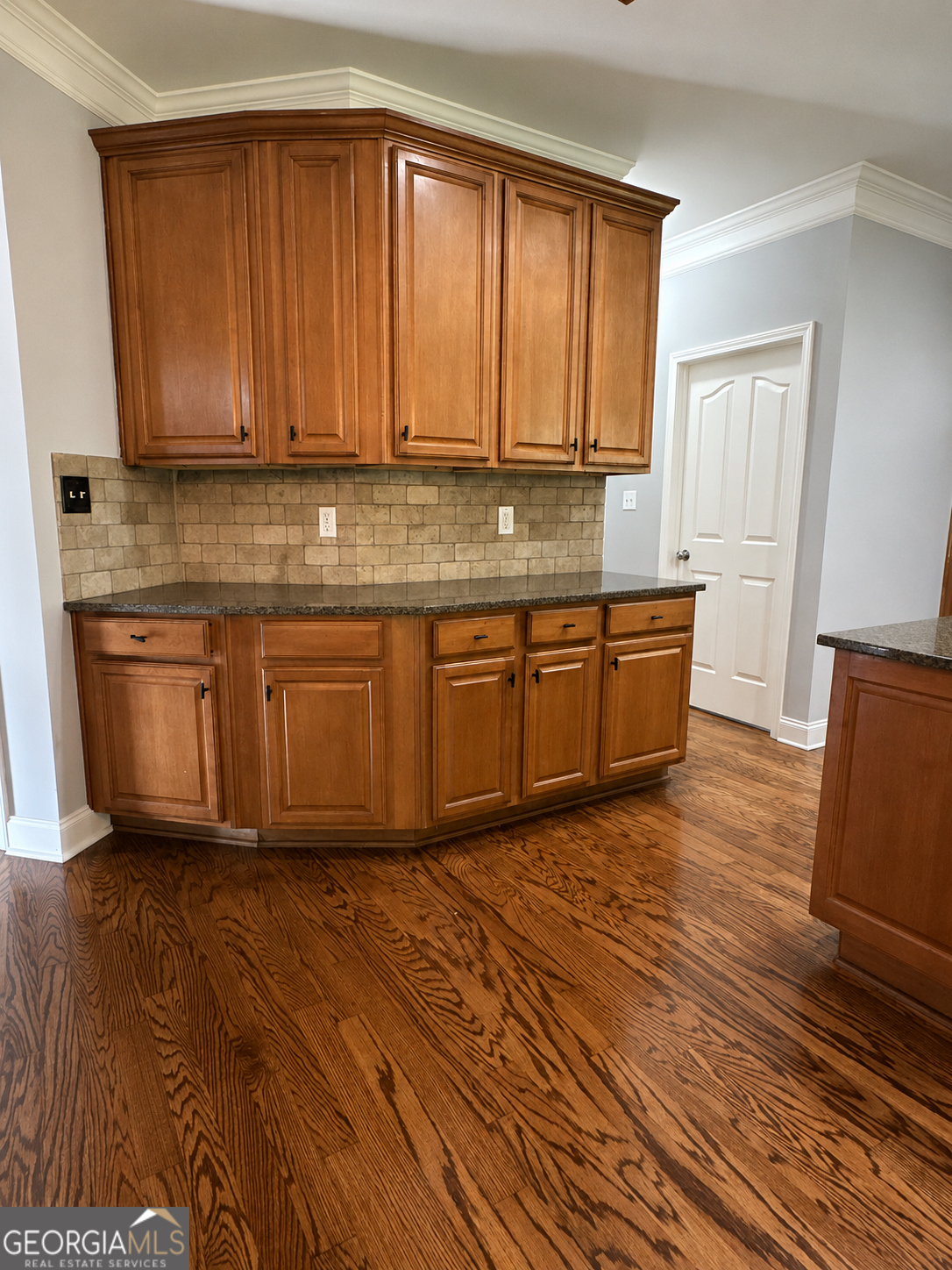 2614 Dolostone Way Dacula, GA 30019 - Photo 11 of 29 a view of a kitchen with granite countertop wooden cabinets