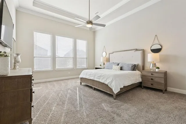 a bed room with a bed and a chandelier