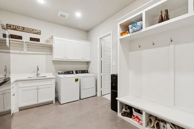 a kitchen with a sink a stove and cabinets