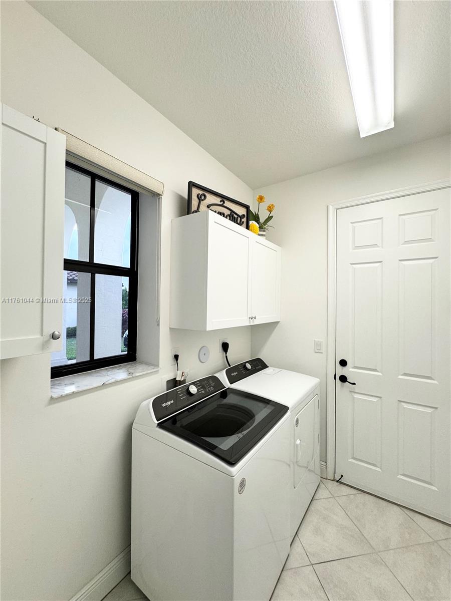 5008 Salerno Street Ave Maria, FL 34142 - Photo 14 of 46 a utility room with sink dryer and washer