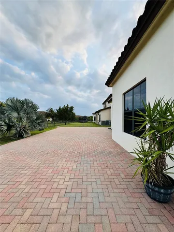a view of a swimming pool and a yard