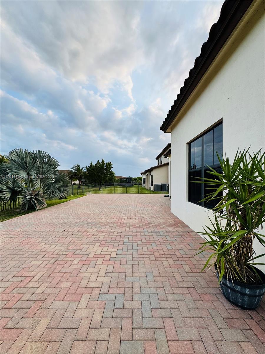 5008 Salerno Street Ave Maria, FL 34142 - Photo 28 of 46 a view of a house with a yard