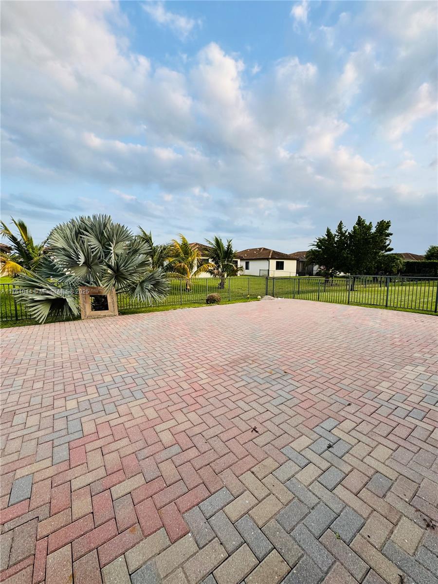 5008 Salerno Street Ave Maria, FL 34142 - Photo 30 of 46 a view of a swimming pool and a yard
