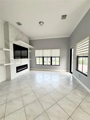 a view of an empty room and window