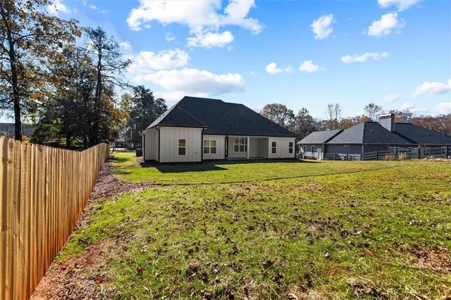 a kitchen with stainless steel appliances a refrigerator sink and cabinets