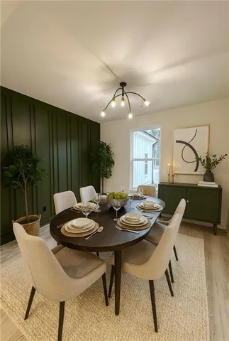an empty room with wooden floor closet and windows