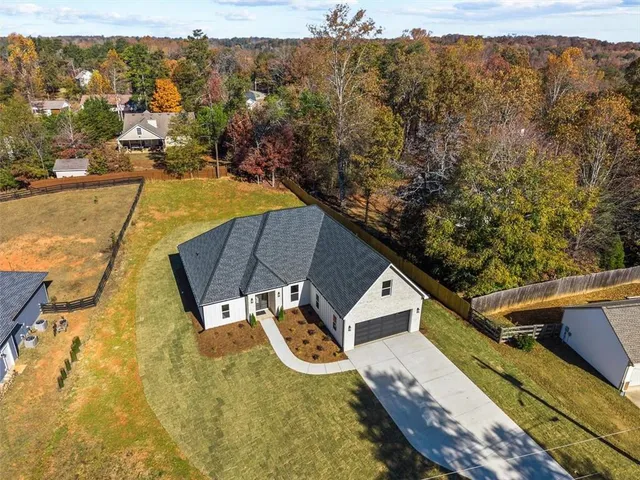 a front view of a house with yard