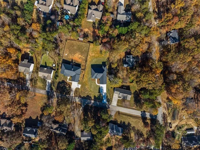 a view of house with swimming pool