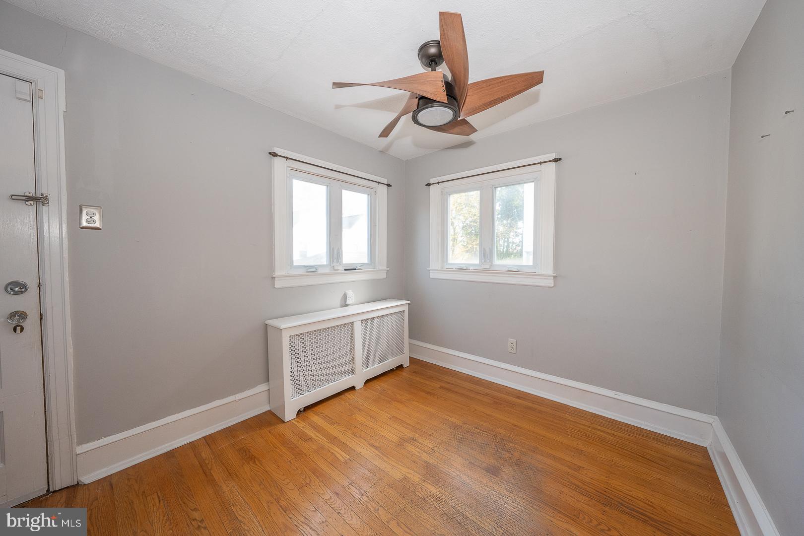 2939 Berkley Road Ardmore, PA 19003 - Photo 12 of 37 a view of empty room with wooden floor and ceiling fan