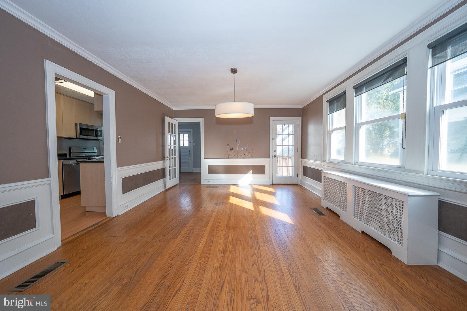 2939 Berkley Road Ardmore, PA 19003 - Photo 15 of 37 an empty room with wooden floor and windows